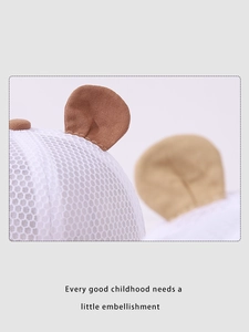 Detail of breathable white mesh baby sun hat with cute 3D brown animal ear decorations