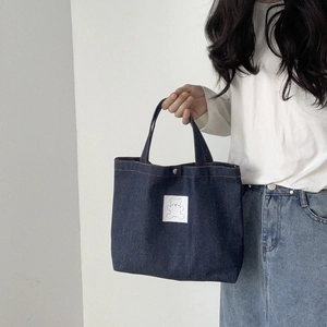 Minimalist dark blue denim tote bag with cute white bear patch for office lunch