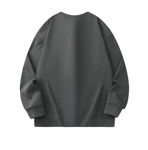 Back view of dark grey crewneck sweatshirt with ribbed cuffs and drop shoulder texture