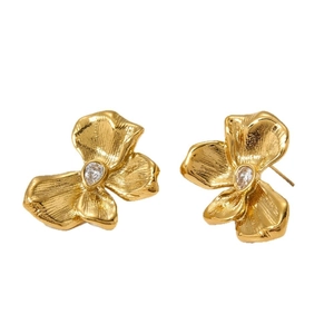 Golden flower stud earrings in brushed metal texture with sparkling teardrop stones