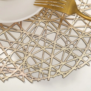 Macro shot of golden hollow PVC placemat with irregular geometric pattern texture