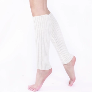 Detailed knit texture of white leg warmers showing the vertical ribbed pattern design