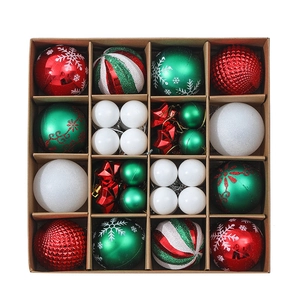 Detailed top view of a red, green, and white Christmas ball ornament set in a cardboard box