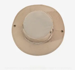 Top-down view of a tan outdoor sun hat featuring reinforced stitching and metal snap buttons