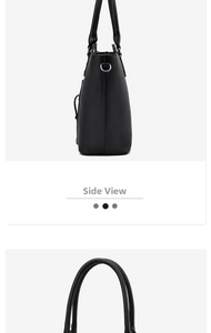 Side view of high-quality black leather tote bag showing handles and metal D-rings
