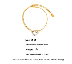 Detail of double-layer hollow heart bracelet in gold and silver finish stainless steel