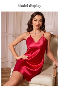 Elegant model seated in a red satin V-neck nightgown with smooth silk-like texture