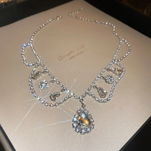 Elegant silver teardrop choker necklace with sparkling rhinestones and geometric design