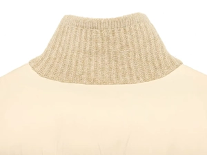 Detailed close-up of the beige knit stand-up collar showing rib texture and fine stitching