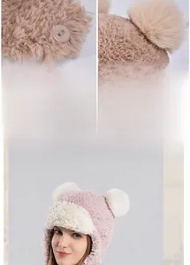 Detailed close-up of plush earmuff hat featuring adjustable buttons and fluffy pompom