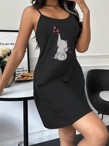 Detail of black camisole nightdress featuring cartoon elephant and pink hearts print