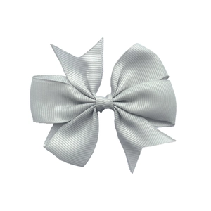 Detailed close-up of a silver grey ribbed grosgrain ribbon bow hair accessory for kids
