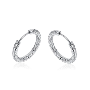 Minimalist silver hammered titanium steel hoop earrings with textured finish on white background
