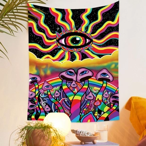 Detail view of psychedelic tapestry with rainbow eye and mushrooms hanging on the wall