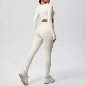 Close-up of the back-view of a cream yoga set showing high-waist fit and lift design