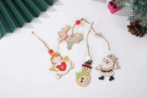 Flat lay of hand-painted wooden Christmas ornaments including Santa, snowman and deer