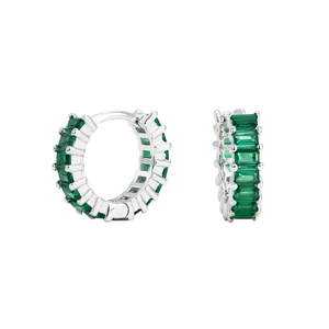 Detail of silver hoop earrings with emerald-cut green gemstones on white background