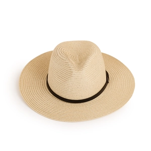 Close-up of wide-brim straw sun hat featuring woven texture and black leather strap