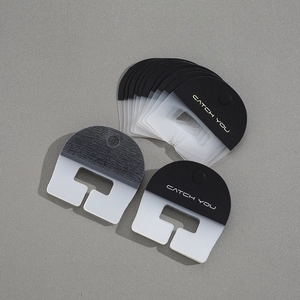 Close-up of durable PVC phone lanyard tether tabs with CATCH YOU text in various colors