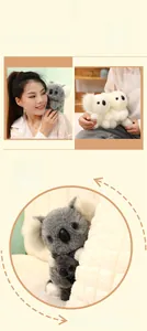 Detail of soft plush koala stuffed animal showing fluffy ears and grey faux fur texture