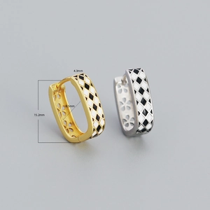 Detail view of checkerboard earrings with dimensions 4.3mm width and 15.2mm height