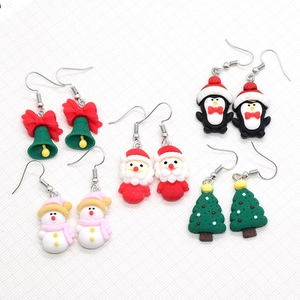 Festive Christmas resin earrings set featuring Santa, snowman, penguin, and tree designs