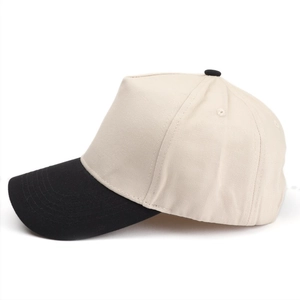 Detailed side view of a two-tone baseball cap with cream crown and black curved brim