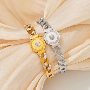 Elegant gold and silver pavé link bracelets with Greek key motif on silk background