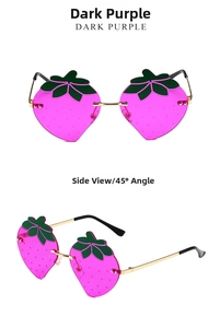 Close-up of strawberry shaped rimless sunglasses in dark purple with gold metal frame