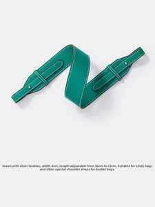 Detail of green litchi texture leather bag strap with 4cm width and silver hardware