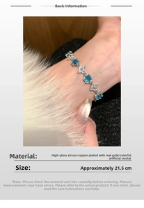 Detail showing blue zircon and white flower crystals with dimensions for this gold bracelet