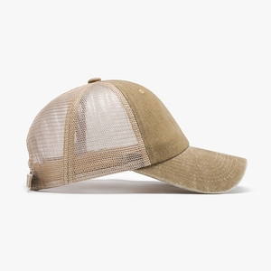 Khaki washed cotton trucker hat with breathable mesh and curved brim for outdoor sun protection