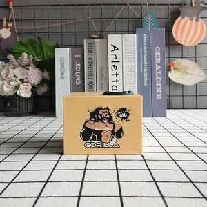 Electric gorilla piggy bank in orange, toy money box with King Kong graphics for room decor
