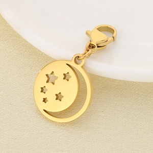 Macro detail of golden stainless steel hollow star and moon pendant with lobster clasp