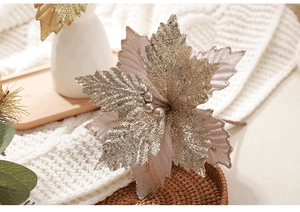 Detail of champagne gold glitter poinsettia flower with sequins for Christmas tree decor