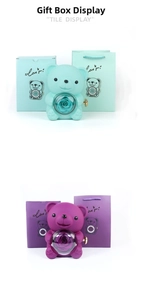 Detail of bear-shaped floral gift box with rotating rose and matching packaging