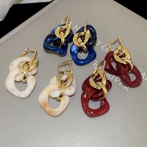 Vintage acrylic link drop earrings in blue, cream, and red with gold-tone accents