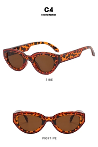 Détails de lunettes de soleil œil de chat léopard avec ligne rouge et verres bruns
