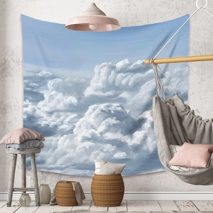 Detail of bohemian wall tapestry featuring realistic blue sky and clouds oil painting design