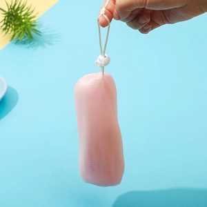 Detail of pink 6-layer mesh foaming net with white drawstring for facial cleansing