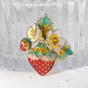 Fashionable enamel strawberry brooch with green leaves and a yellow crystal flower
