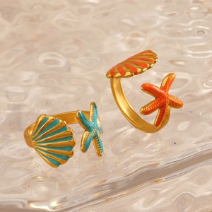 Adjustable starfish and shell rings in orange and turquoise drip oil on water background