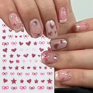 Detailed pink bow and heart glitter nail stickers showing applied effect and sheets