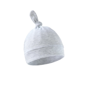 Detailed view of light grey cotton knit newborn hat with knotted top and cuffed brim