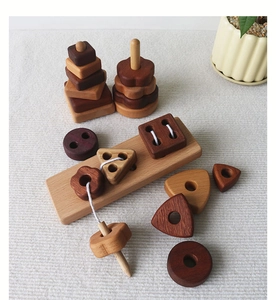 Detail of wooden geometric stacking blocks and lacing toy for early sensory education