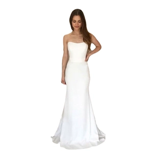 Elegant white strapless mermaid wedding gown in premium satin for a sleek bridal silhouette