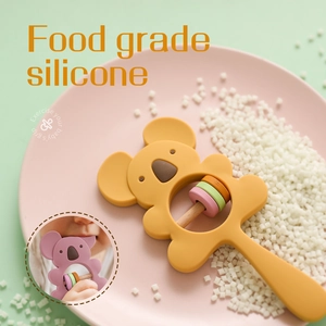 Yellow silicone koala baby teether and wooden rattle for infant sensory grip exercise