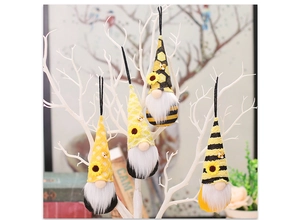 Hanging bee gnome ornaments with sunflower hats on white branches for festive decor