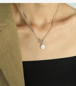 Detail of silver dual-chain necklace with toggle clasp and engraved Beloved pendant