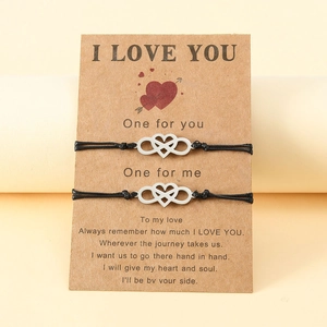 Handmade woven couple bracelets with silver heart infinity symbol on kraft card